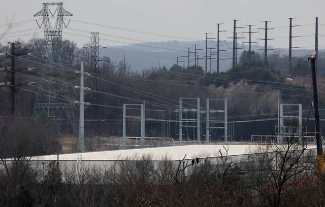 A building complex that houses Compass Datacenters is partially visible from a nearby neighborhood in Broadlands, Virginia, U.S., March 13, 2025. REUTERS/Leah Millis/File Photo