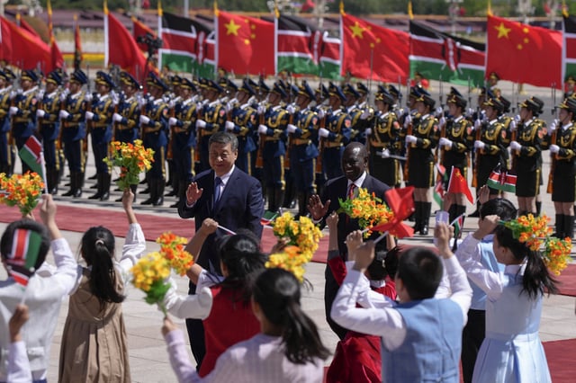 China&#39;s President Xi Jinping (L) and Kenya&#39;s visiting President William Ruto wave during a ceremony at the Great Hall of the People in Beijing on April 24, 2025. China is seen as an ally in three sub-Saharan African countries surveyed by Pew Research Center.