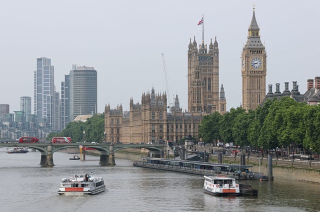 Boats sail on the River Thames near to The Houses of Parliament, on the day when trade talks are due to take place in London between the U.S. and China, in London, Britain, June 9, 2025. REUTERS/Toby Melville/File Photo