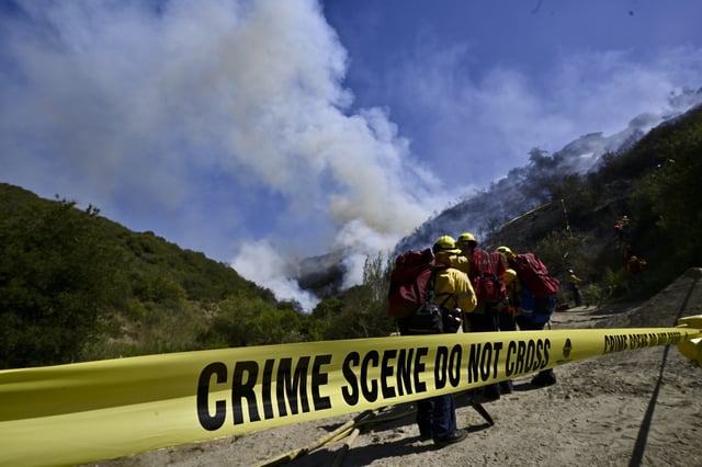 Smoke fills the sky as firefighters battle the Rancho Fire in Laguna Beach, Calif., on Monday, July 7, 2025. (Jeff Gritchen/The Orange County Register via AP)