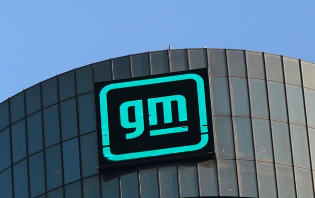 The GM logo is seen on the facade of the General Motors headquarters in Detroit, Michigan, U.S., March 16, 2021. REUTERS/Rebecca Cook/ File Photo
