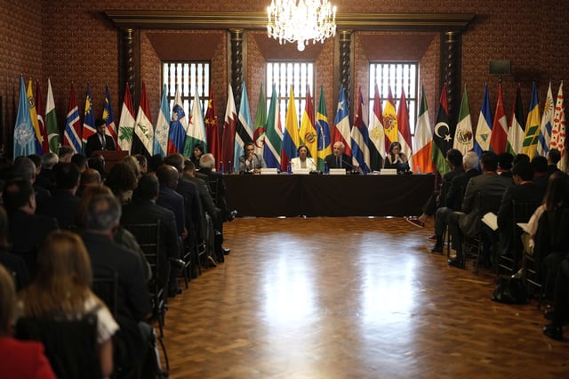 Riyad Mansour, Palestinian U.N. ambassador, top, second from right, speaks in Bogota, Colombia, Tuesday, July 15, 2025, during a two-day conference to address the Israel-Hamas war and Israel's military actions in Gaza. Second from left at the table is Colombian Foreign Minister Rosa Yolanda Villavicencio. At far right at table is U.N. Special Rapporteur on the Occupied Palestinian Territories Francesca Albanese. At far left at table is Zane Dangor, South Africa's Foreign Minister. (AP Photo/Fernando Vergara)