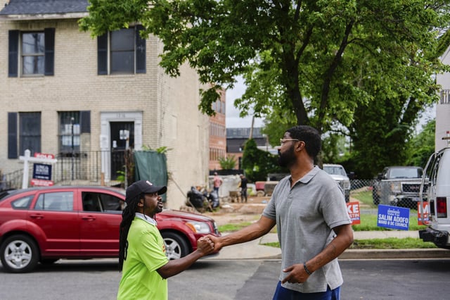 Former District of Columbia Councilman Trayon White talks to a voter outside Union Temple Baptist Church during the Ward 8 special election, Tuesday, July 15, 2025, in Washington. (AP Photo/Julia Demaree Nikhinson)