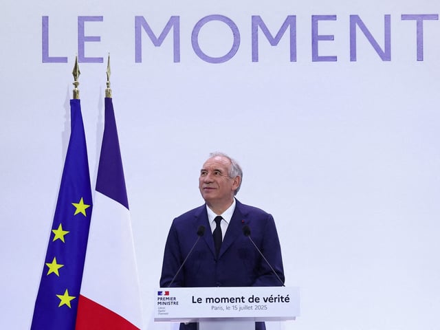 French Prime Minister Francois Bayrou reacts during a news conference to present a major public finance recovery plan, outlining his first budgetary orientations for 2026, in Paris, France, July 15, 2025. The slogan reads "The moment of truth". REUTERS/Abdul Saboor      TPX IMAGES OF THE DAY