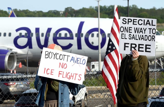 People protest Avelo Airlines&#39; decision to fly deportation flights for ICE at the entrance to Tweed New Haven Regional Airport, as seen on May 12.