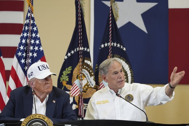 Texas Gov. Greg Abbott speaks as President Donald Trump listens during a roundtable discussion with first responders and local officials at Hill Country Youth Event Center in Kerrville, Texas, during a tour to observe flood damage, Friday, July 11, 2025. (AP Photo/Jacquelyn Martin)