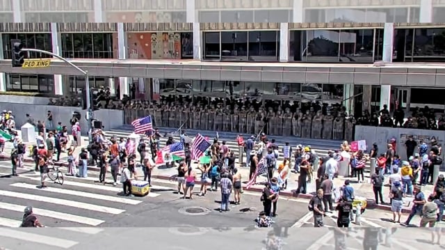 Protesters block traffic at Los Angeles Streets between Aliso and Temple Streets in Downtown Los Angeles on Friday, July 4, 2025. (Photo from LAPD Central Division on X)