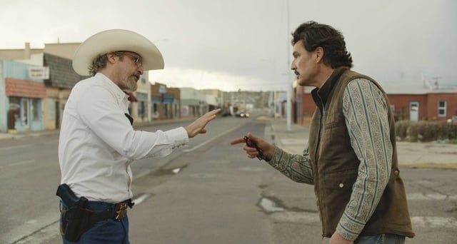 Sheriff Joe Cross (Joaquin Phoenix, left) and Mayor Ted Garcia (Pedro Pascal) face off in Ari Aster’s “Eddington.”