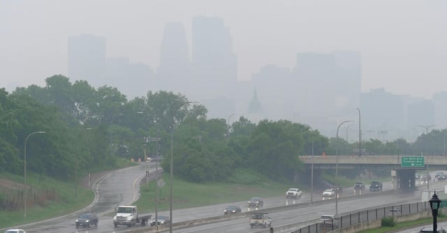 Smoke from wildfires burning in Canada and rain obscures the downtown skyline of Minneapolis on June 3.