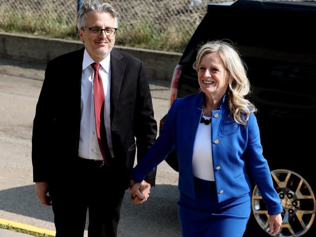 Alberta NDP leader Rachel Notley and husband Lou Arab, left, arrive for a provincial leaders debate with UCP leader Danielle Smith at CTV Edmonton on May 18, 2023. 