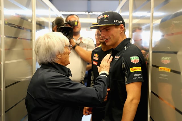 F1 supremo Bernie Ecclestone talks with Max Verstappen of Netherlands and Red Bull Racing and Daniel Ricciardo of Australia and Red Bull Racing before the United States Formula One Grand Prix at Circuit of The Americas on October 23, 2016 in Austin, United States.