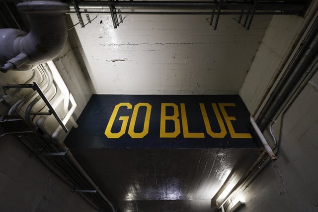 A detail view of the University of Michigan Wolverines &#34;Go Blue&#34; logo prior to an NCAA college football game between the University of Michigan Wolverines and the Michigan State University Spartans on Saturday, Oct. 7, 2017 in Ann Arbor, Mich.