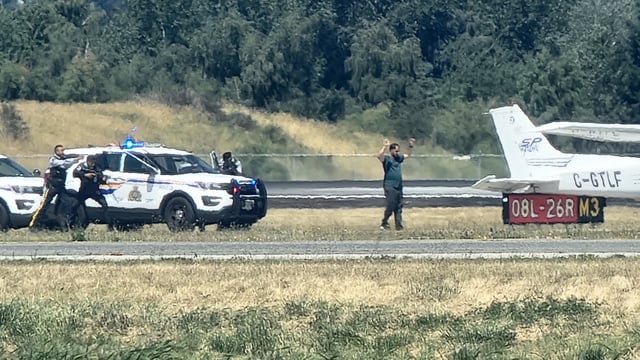 Richmond RCMP officers on the scene at Vancouver International Airport on Tuesday afternoon.