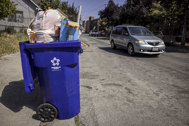 Unemptied trash bins line the street on Brookside Drive in Richmond during a Republic Services workers solidarity strike on Tuesday, July 15, 2025. Workers for Republic Services, the garbage collection agency that collects household waste weekly in dozens of Bay Area cities, are now on their second week of a solidarity strike with their national Teamsters union.