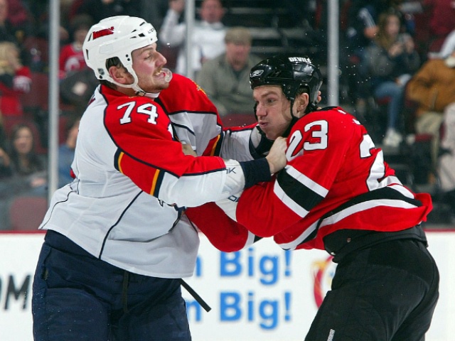 NEWARK, NJ - FEBRUARY 28:  David Clarkson #23 of the New Jersey Devils trades punches with Nick Tarnasky #74 the Florida Panthers at the Prudential Center on February 28, 2009 in Newark, New Jersey. The Devils defeated the Panthers 7-2.  (Photo by Jim McIsaac/Getty Images)