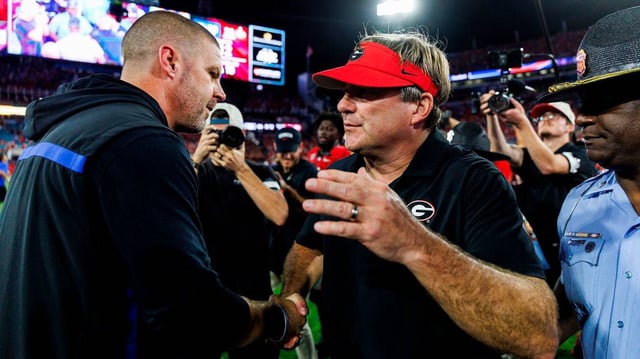 Head coach Kirby Smart of the Georgia Bulldogs (right) and head coach Billy Napier of the Florida Gators (left) meet after a game at EverBank Stadium on Nov. 2, 2024, in Jacksonville, Florida. (James Gilbert/Getty Images/TNS)