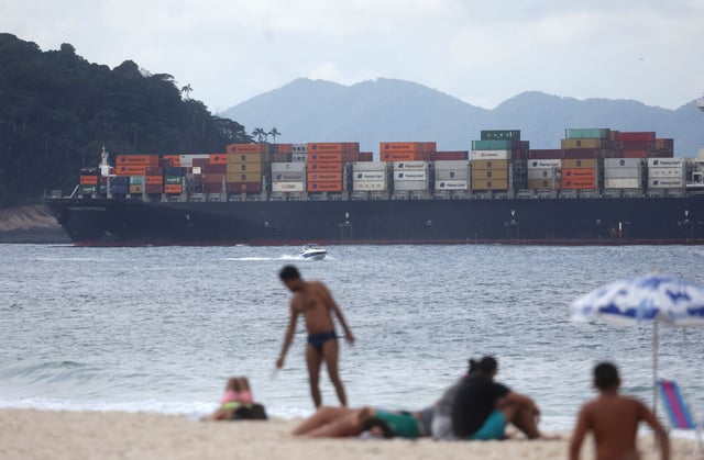 A cargo ship is seen from Copacabana beach in Rio de Janeiro, Brazil, on July 10, 2025.