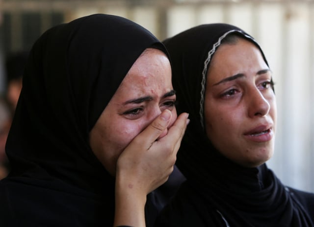People mourn Palestinians who were killed in an incident on Wednesday while seeking aid in Khan Younis, at Nasser hospital in Khan Younis in the southern Gaza Strip July 16, 2025. REUTERS/Hatem Khaled
