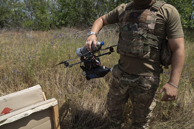 DONETSK OBLAST, UKRAINE - JUNE 17: Soldiers from a fiber-optic drone unit of the 93rd Brigade test the drones before going to the front lines in Donetsk Oblast, Ukraine, on June 17, 2025. The drones, which operate without radio signals, are harder to detect or jam and use fiber-optic cables to transmit high-quality images from a distance. Jose Colon / Anadolu