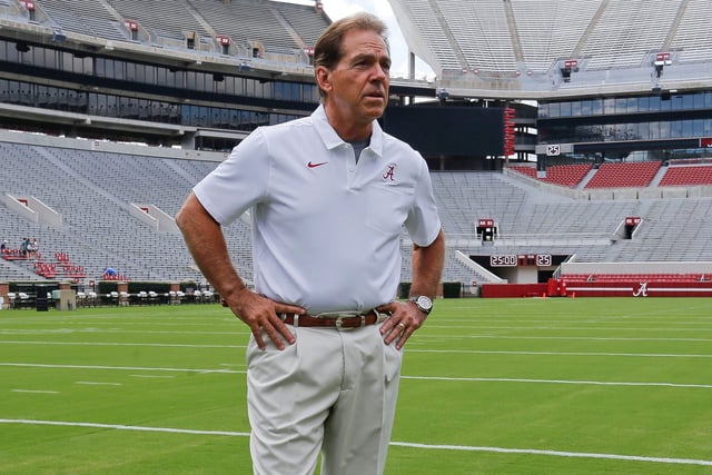 Alabama football coach Nick Saban stands on the turf inside Bryant-Denny Stadium during his team's media day in 2019.