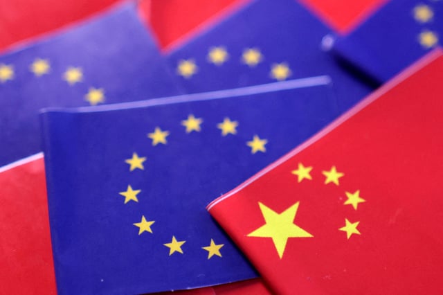 EU and Chinese flags are seen in this illustration taken, March 20, 2025. REUTERS/Dado Ruvic/Illustration/File Photo