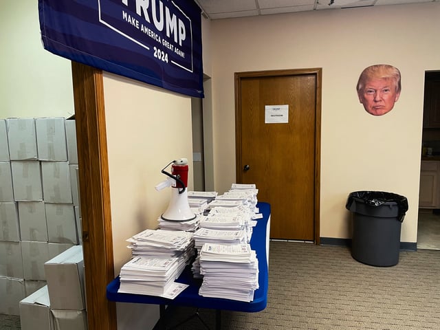 Stacks of caucus pledge cards collected from supporters of Donald Trump are seen at the campaign's headquarters in Urbandale, Iowa, U.S., October 14, 2023. REUTERS/Nathan Layne/File Photo