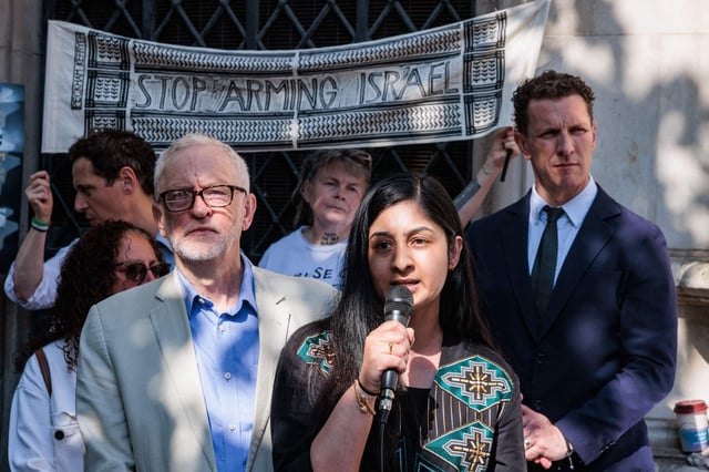 Zarah Sultana, MP for Coventry South, addresses a rally outside the Royal Courts of Justice alongside Jeremy Corbyn, on 13 May 2025. Photo: Mark Kerrison/Alamy