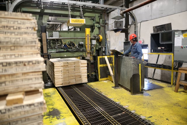 Finished lumber is run through the wrap-and-strap machine at West Fraser Pacific Inland Resources sawmill in Smithers, British Columbia, Canada February 4, 2020. REUTERS/Jesse Winter/File Photo