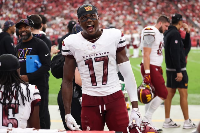Terry McLaurin #17 of the Washington Commanders reacts after a score during the fourth quarter against the Arizona Cardinals at State Farm Stadium on September 29, 2024 in Glendale, Arizona.