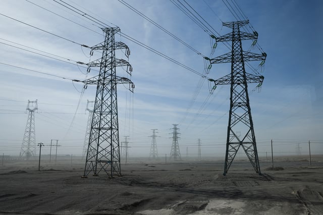 A general view of electricity pylons during an organised media tour in Jiuquan, Gansu province, China October 17, 2024. REUTERS/Tingshu Wang/File Photo