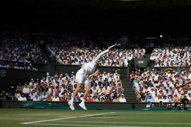 3BRPB72 London, UK. 13th July 2025; All England Lawn Tennis and Croquet Club, London, England; Wimbledon Tennis Tournament, Day 14; Jannik Sinner (ITA) serves to Carlos Alcaraz (ESP) during the Gentlemen's singles final match Credit: Action Plus Sports Images/Alamy Live News