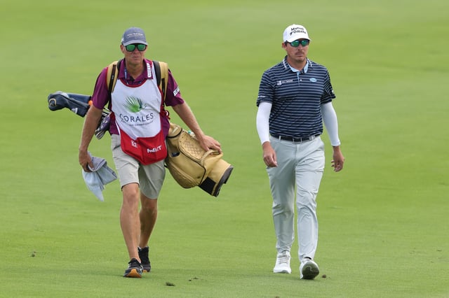 Joel Dahmen of the United States and caddie Geno Bonnalie walk down the 14th fairway during the final round of the Corales Puntacana Championship 2025 at Puntacana Resort &amp; Club, Corales Golf Course on April 20, 2025 in Punta Cana, Dominican Republic.