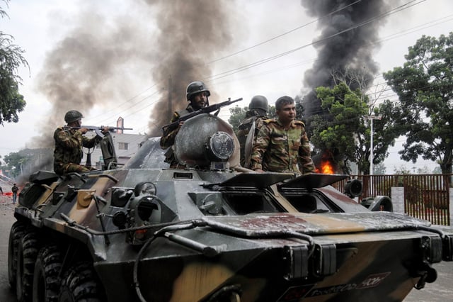 Soldiers sit atop an APC after armed forces were deployed, following a clash during a National Citizen Party rally, in Gopalganj, Bangladesh, July 16, 2025. REUTERS/Anik Rahman