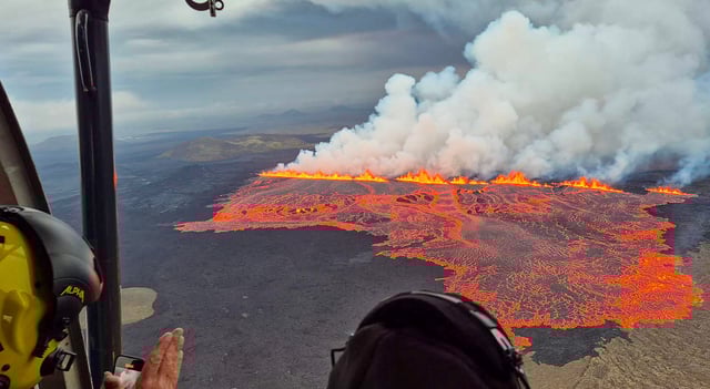 Handout picture released on July 16, 2025 by the Public Defense Department of the State Police Commissioner in Iceland shows lava and smoke erupting from a volcano near Grindavik on the Icelandic peninsula of Reykjanes. A volcano erupted on Wednesday in Iceland's Reykjanes peninsula in the southwest, weather authorities said, the ninth eruption to hit the region since the end of 2023. Broadcaster RUV reported that the nearby fishing village Grindavik had been evacuated, as had the Blue Lagoon, Iceland's famed tourist spot.