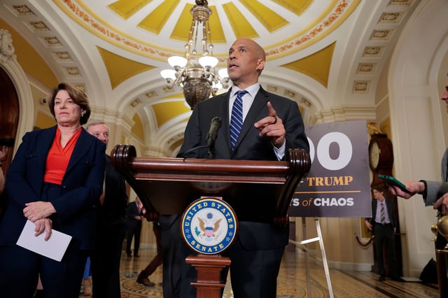 WASHINGTON, DC - APRIL 29: U.S. Sen. Cory Booker (D-NJ) speaks to reporters alongside U.S. Sen. Amy Klobuchar (D-MN) (L) and U.S. Sen. Richard Durbin (D-IL) (C) following the weekly Senate Democrat policy luncheon at the U.S. Capitol on April 29, 2025 in Washington, DC. During the news conference Senate Democrats spoke of U.S. President Donald Trump's first 100 days back in office. (Photo by Anna Moneymaker/Getty Images)