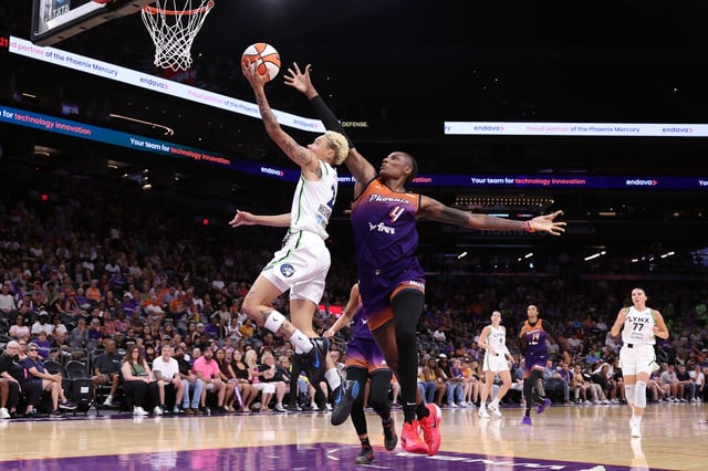 Natisha Hiedeman #2 of the Minnesota Lynx attempts a layup against Natasha Mack #4 of the Phoenix Mercury during the first half at PHX Arena on July 09, 2025 in Phoenix, Arizona.