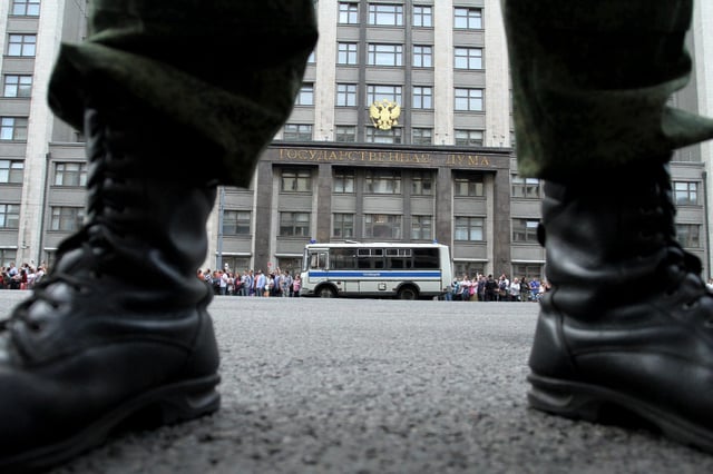A soldier stands guard in front of the State Duma in central Moscow on July 18, 2013, during a protest after opposition leader Alexei Navalny was sentenced to five years in a penal colony after being found him guilty of embezzlement in a timber deal. Judge Sergei Blinov said he found Navalny guilty of colluding to steal money in a timber deal while acting as an unpaid advisor to the local government in the northern Kirov region. AFP PHOTO/IVAN NOVIKOV (Photo credit should read IVAN NOVIKOV/AFP/Getty Images)