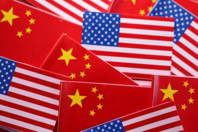 U.S. and Chinese flags are seen in this illustration created on March 20, 2025. REUTERS/Dado Ruvic/Illustration/File Photo