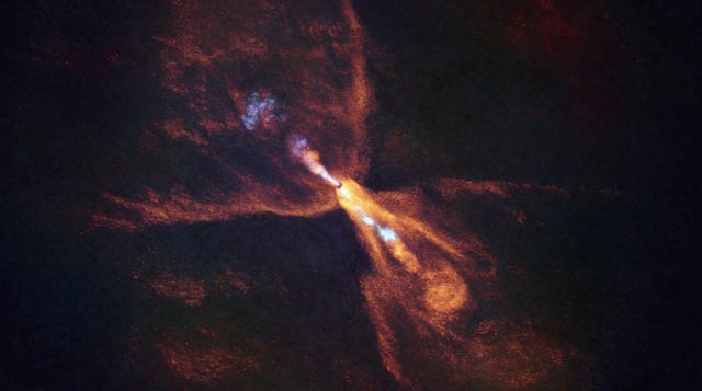 Diese Aufnahme des ALMA-Observatoriums zeigt heiße Gase um den Protostern HOPS-315. In seiner protoplanetaren Scheibe haben Astronomen Silikatkristalle nachgewiesen – erste Bausteine der späteren Planetesimale und Planeten. © ALMA(ESO/NAOJ/NRAO), M. McClure et al.