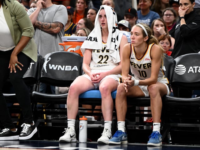 Caitlin Clark #22 of the Indiana Fever sits on the bench after being taken out of a game with a possible injury during the second half of a game against the Connecticut Sun at the TD Garden on July 15, 2025 in Boston, Massachusetts.