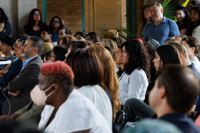 People watch an excerpt from the documentary “Cooked: Survival by Zip Code,” about the 1995 Chicago heat wave, at the Columbus Park Refectory on July 15, 2025. A panel discussion on the heat wave followed. (Armando L. Sanchez/Chicago Tribune)