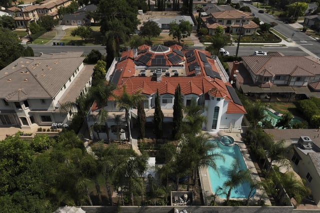 An aerial view shows the home of Silvia Zhang and Guojun Xuan on Wednesday, July 16, 2025, in Arcadia, Calif., where a number of children were removed from the couple's home after a child abuse allegation in May, according to Arcadia police. (AP Photo/Jae C. Hong)