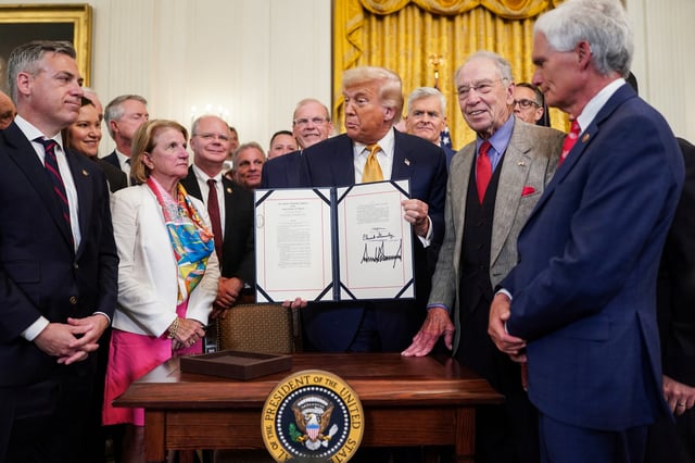 U.S President Donald Trump holds the HALT Fentanyl Act after signing, in the East Room at the White House in Washington, D.C., U.S., July 16, 2025. REUTERS/Nathan Howard