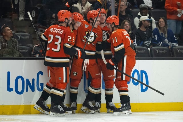 Ducks players celebrate a goal by right wing Sam Colangelo during the third period of an NHL hockey game against the Toronto Maple Leafs, Sunday, March 30, 2025, in Anaheim, Calif. (AP Photo/Kyusung Gong)