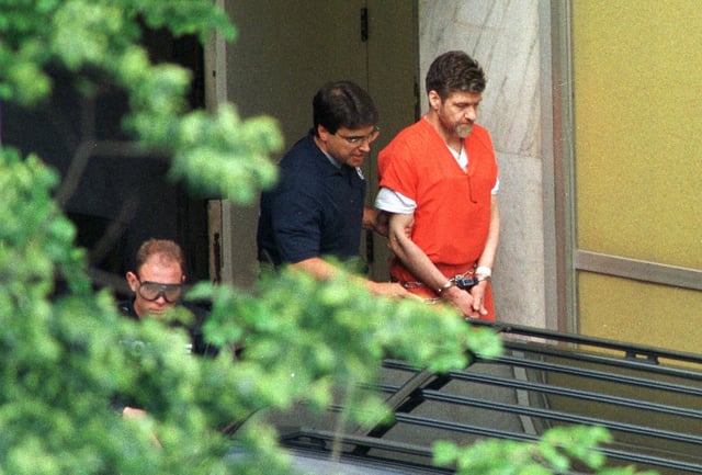 Convicted Unabomber Theodore Kaczynski is escorted by US Marshals outside the Sacramento County Federal Court, Sacramento, California, May 4, 1998.