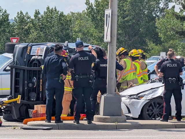 First responders at the scene of a collision involving a Calgary police vehicle on Crowchild Trail N.W. on Wednesday.
