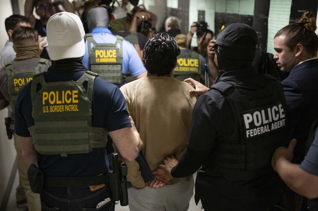 Federal agents detain a person after attending a court hearing at immigration court at the Jacob K. Javitz Federal Building on July 1 in New York City, New York.
