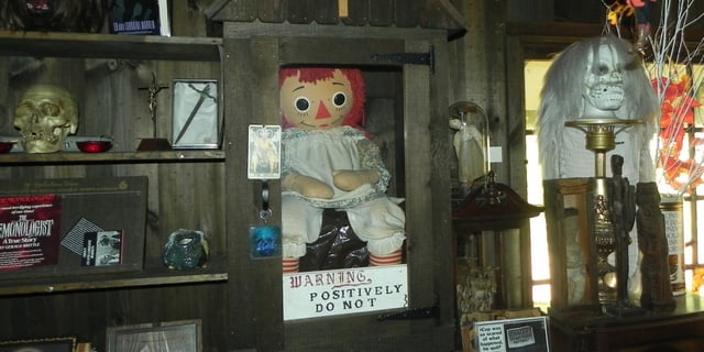 The Annabelle Raggedy Ann's case in the Warren's Occult Museum.