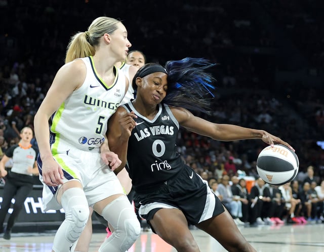 Jackie Young #0 of the Las Vegas Aces drives into Paige Bueckers #5 of the Dallas Wings in the second quarter of their game at Michelob ULTRA Arena on June 13, 2025 in Las Vegas, Nevada.