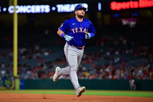 Jul 8, 2025; Anaheim, California, USA; Texas Rangers first baseman Jake Burger (21) runs the bases after hitting a solo home run against the Los Angeles Angels during the seventh inning at Angel Stadium. Mandatory Credit: Gary A. Vasquez-Imagn Images/File Photo